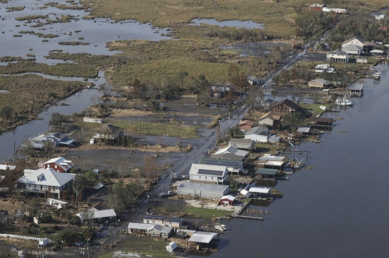 A view of flood damaged buildings are seen as President Joe Biden (not pictured) inspects the damage from Hurricane Ida on the Marine One helicopter during an aerial tour of communities in Laffite, Grand Isle, Port Fourchon and Lafourche Parish, Louisiana, Friday, Sept. 3, 2021. (Jonathan Ernst/Pool via AP)


