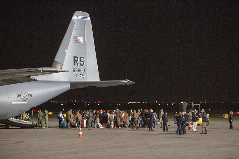 FILE - In this Aug. 29, 2021, file photo families evacuated from Kabul, Afghanistan, walk past a U.S Air Force plane that they arrived on at Kosovo's capital Pristina International Airport. (AP Photo/Visar Kryeziu, File)


