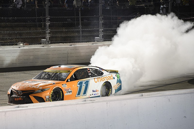 AP photo by John Amis / Denny Hamlin does a burnout after winning the Southern 500, the opening race of the NASCAR Cup Series playoffs, on Sunday night at South Carolina's Darlington Raceway.