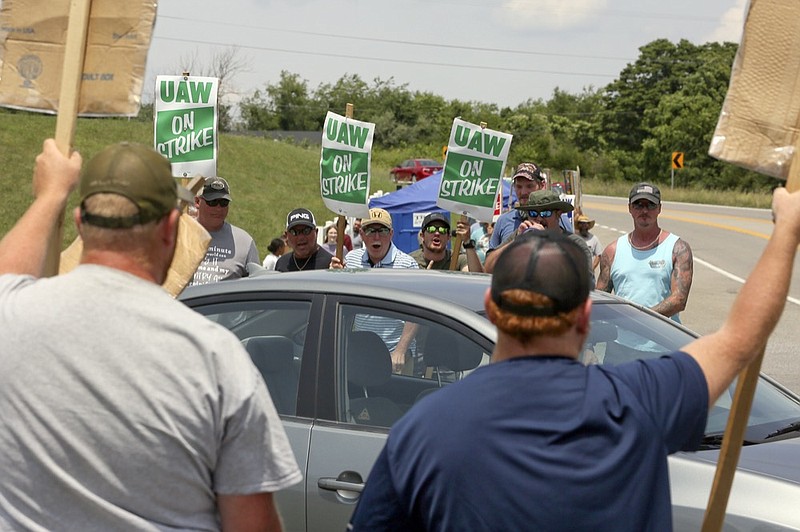 FILE - In this June 18, 2021 file photo, striking UAW members express themselves at vehicles departing the Volvo Trucks North America plant in Dublin, Va. (Matt Gentry/The Roanoke Times via AP)


