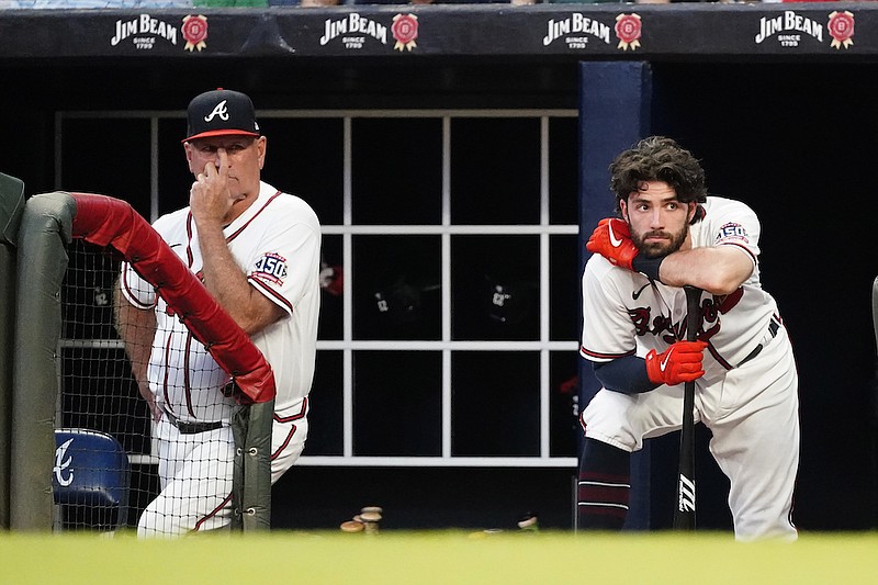 Atlanta Braves manager Brian Snitker (43), left, and shortstop Dansby Swanson is shown against the New York Yankees during a baseball game Monday, Aug. 23, 2021, in Atlanta. (AP Photo/John Bazemore)