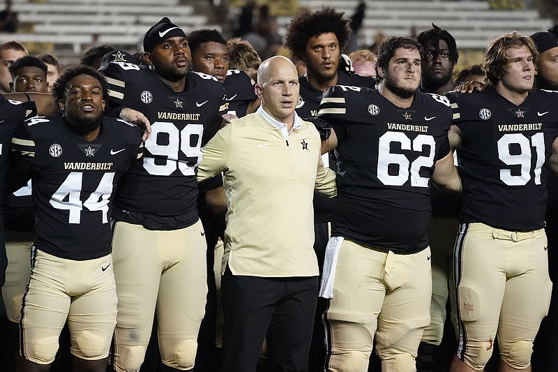 AP Photo by Mark Humphrey / Vanderbilt football coach Clark Lea stands with his players as they sing the school's alma mater after last Saturday night's 23-3 loss to East Tennessee State in Nashville.