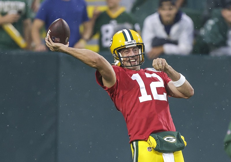 Green Bay Packers quarterback Aaron Rodgers throws a pass during an NFL football training camp at Lambeau Field Saturday, Aug. 7, 2021, in Green Bay, Wis. (AP Photo/Matt Ludtke)