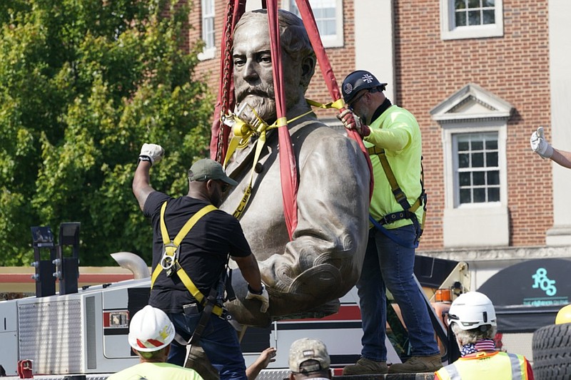 Crews remove the torso of Confederate General Robert E. Lee, one of the country's largest remaining monuments to the Confederacy, on Monument Avenue in Richmond, Va., Wednesday, Sept. 8, 2021. (AP Photo/Steve Helber)