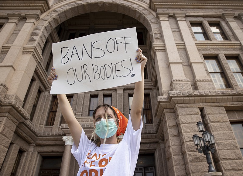 Photo by Jay Janner/Austin American-Statesman via AP / In this Sept. 1, 2021, file photo, Jillian Dworin participates in a protest against the six-week abortion ban at the Capitol in Austin, Texas.