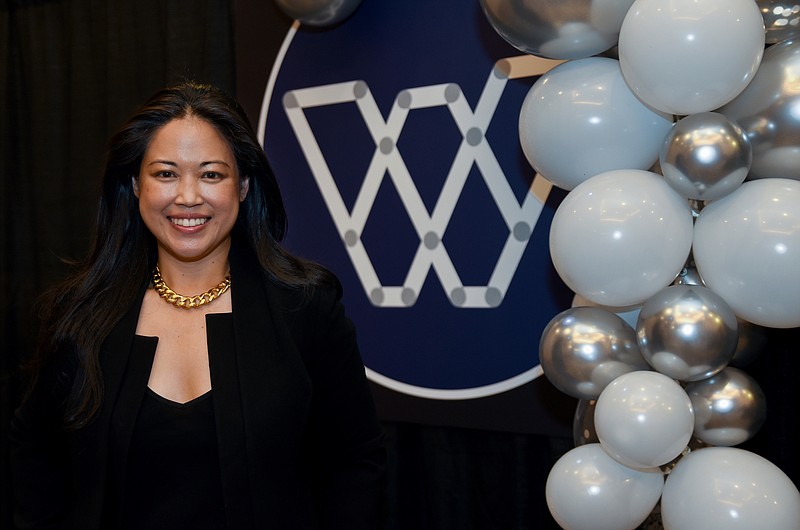 Photo by Angela Lewis Foster / Keynote speaker Lisa Sun, CEO and Founder of Gravitas, stands Thursday outside of the dining area before the CWLI's 16th Annual IMPACT dinner at the Chattanooga Convention Center.