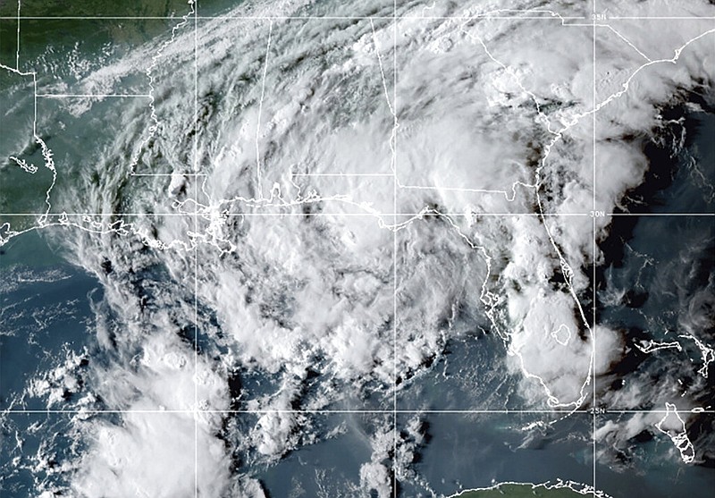 This GOES- East GeoColor satellite image taken Wednesday, Sept. 8, 2021, at 10:30 p.m. EDT., and provided by NOAA, shows Tropical Storm Mindy as it makes landfall on the Florida Panhandle. The storm touched down over St. Vincent Island, about 10 miles (15 km) west southwest of Apalachicola, according to the National Hurricane Center. (NOAA via AP)