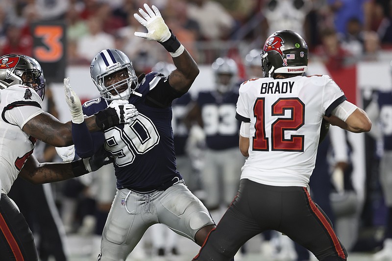 AP photo by Mark LoMoglio / Dallas Cowboys defensive end DeMarcus Lawrence (90) pressures Tampa Bay Buccaneers quarterback Tom Brady during the first half of Thursday night's NFL 2021 season opener in Tampa, Fla.