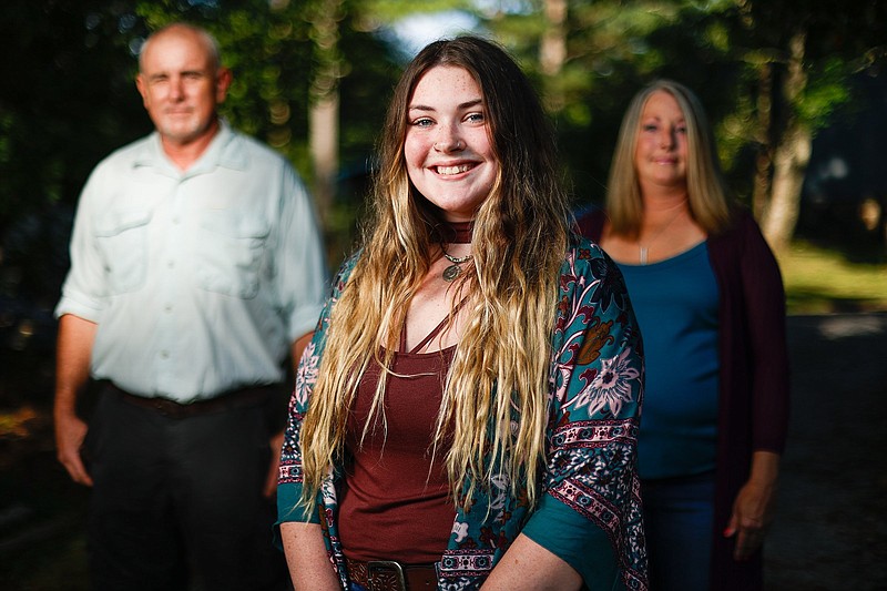 Staff photo by Troy Stolt / Autumn Cordell poses for a portrait with her parents, Jeffery and Mitzi Frederick Cordell on Monday, Sept. 6, 2021, in McDonald, Tenn. Autumn Cordell was born Sept. 11, 2001, as the first hijacked plane struck the World Trade Center in New York City. On the same day almost 3,000 Americans were claimed in the attacks, the Cordells celebrated the arrival of a new life, their daughter.