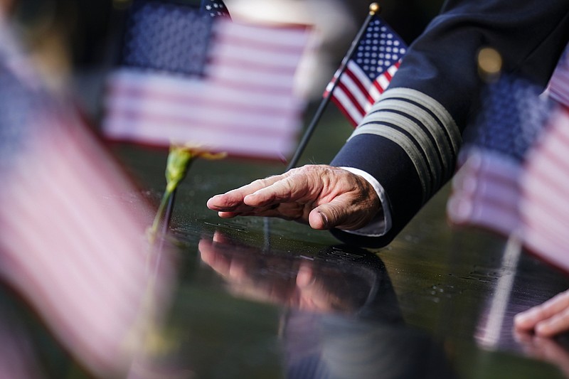 AP Photo/Matt Rourke / A person touches an inscribed name at National September 11 Memorial and Museum ahead of the 20th anniversary of the 9/11 terrorist attacks on Friday, Sept. 10, 2021, in New York.
