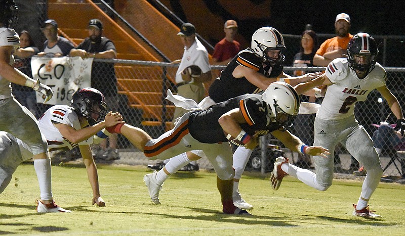 Staff photo by Matt Hamilton / Meigs County's Logan Carroll dives for a touchdown during Friday night's home game against Signal Mountain.