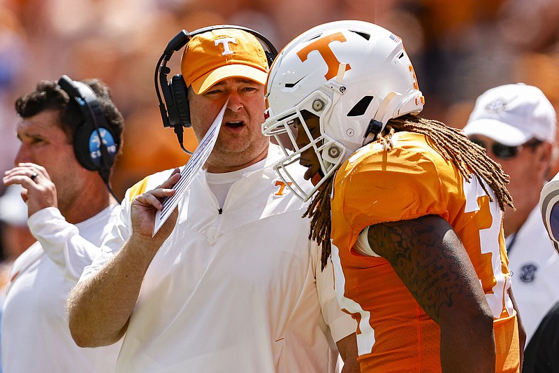 AP photo by Wade Payne / Tennessee football coach Josh Heupel talks to linebacker Jeremy Banks (33) after he was called for unnecessary roughness during the first half of Saturday's home game against Pittsburgh. The Vols finished with 13 penalties for 134 yards, both the most for the program since a win over Vanderbilt in 2000.