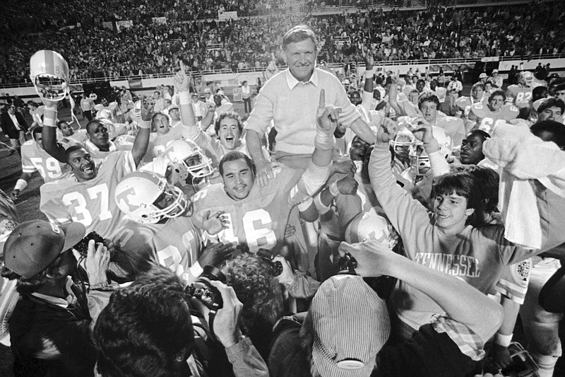 AP photo by Kirk McKoy / University of Tennessee football coach Johnny Majors rides victorious on the shoulders of his team after the Vols defeated Maryland 30-23 in the Citrus Bowl on Dec. 18, 1983, in Orlando, Fla.