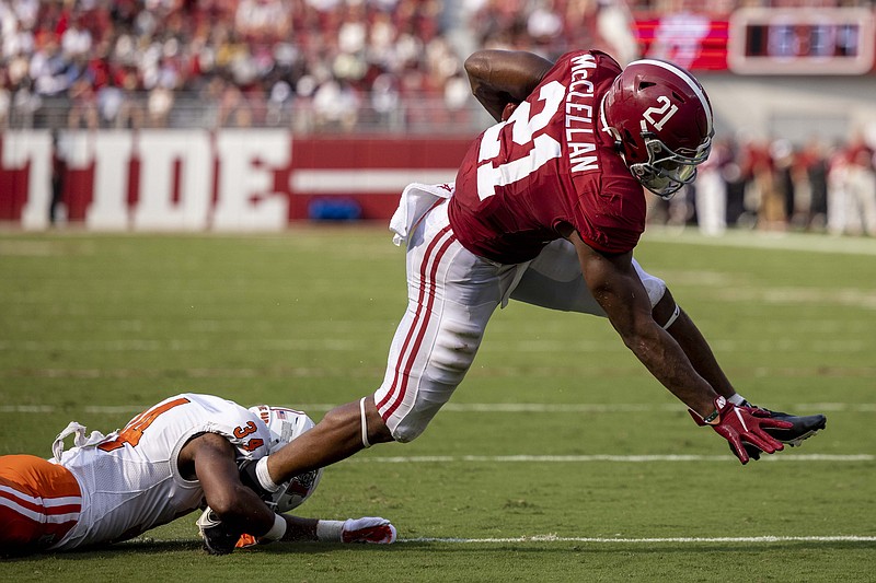 AP photo by Vasha Hunt / Alabama running back Jase McClellan breaks free from Mercer defensive back Myles Redding for a touchdown during the first half of Saturday's game in Tuscaloosa, Ala.