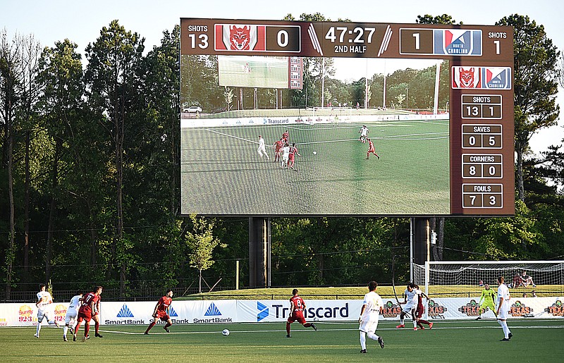 Staff photo by Matt Hamilton / The jumbo video screen on the scoreboard at CHI Memorial Stadium shows the on-field action during the Chattanooga Red Wolves' match against North Carolina FC on June 20 in East Ridge. The Red Wolves won 3-2.