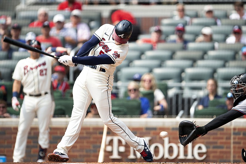 AP photo by Hakim Wright Sr. / Atlanta Braves first baseman Freddie Freeman swings during the first inning of Sunday's home game against the Miami Marlins. Freeman, who turned 32 on Sunday, hit a home run in the seventh inning to help lead the Braves to a 5-3 victory.