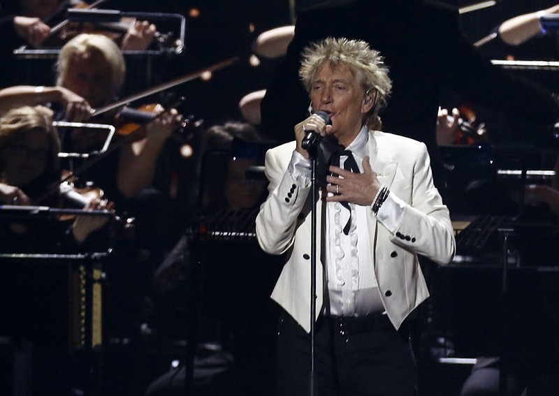 FILE - In this Feb. 18, 2020 file photo, Rod Stewart performs on stage at the Brit Awards 2020 in London. A Florida judge on Thursday, Sept. 9, 2021, has canceled the trial for Stewart and his adult son and scheduled a hearing next month to discuss a plea deal to resolve misdemeanor charges. The singer of 70s hits such as "Da Ya Think I'm Sexy?" and "Maggie May" and his son are accused of pushing and shoving a security guard at an upscale hotel because he wouldn't let them into a New Year's Eve party nearly two years ago. (Photo by Joel C Ryan/Invision/AP, File)