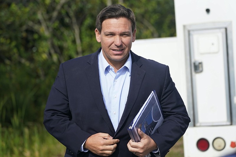 FILE - In this Tuesday, Aug. 3, 2021, file photo, Florida Gov. Ron DeSantis arrives at a news conference, near the Shark Valley Visitor Center in Miami. On Sunday, Sept. 12, three Republican presidential prospects, including DeSantis, sharply condemned President Joe Biden's handling of the end of the war in Afghanistan, rebuking the administration's conduct of the U.S. withdrawal as weak and as emboldening its adversaries. (AP Photo/Wilfredo Lee, File)

