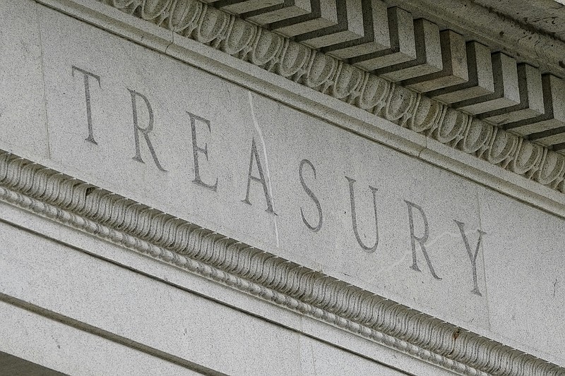 This May 4, 2021 file photo shows the Treasury Building in Washington. The U.S. budget deficit rose to $2.71 trillion through August, on track to be the second largest in history due to trillions of dollars in COVID relief. In its monthly budget report, the Treasury Department said Monday, Sept. 13, that the deficit for the first 11 months of this budget year is 9.9% less than the imbalance during the same period last year. (AP Photo/Patrick Semansky, file)