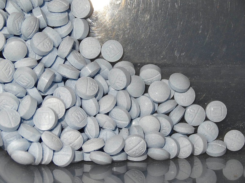 FILE - This undated file photo provided by the U.S. Attorneys Office for Utah and introduced as evidence at a trial shows fentanyl-laced fake oxycodone pills collected during an investigation. (U.S. Attorneys Office for Utah via AP, File)