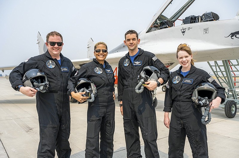 In this Aug. 8, 2021 photo provided by John Kraus, from left, Chris Sembroski, Sian Proctor, Jared Isaacman and Hayley Arceneaux stand for a photo in Bozeman, Mont., during a "fighter jet training" weekend to familiarize the crew with G-forces. (John Kraus/Inspiration4 via AP)

