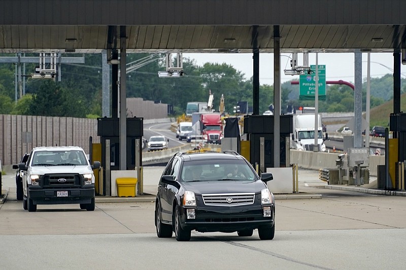 Traffic going eastbound on the Pennsylvania Turnpike proceeds through the electronic toll booths in Cranberry Township, Pa., on Monday, Aug. 30, 2021. (AP Photo/Keith Srakocic)


