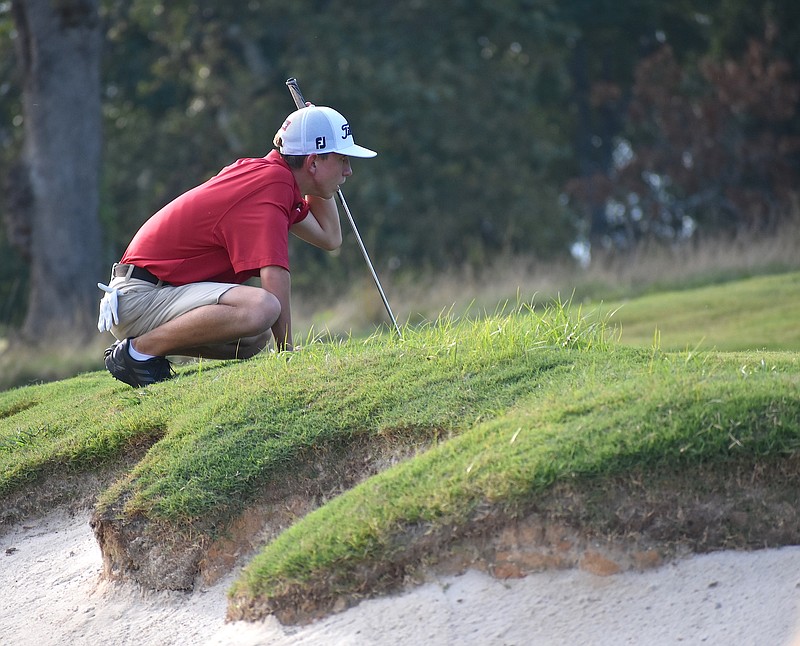 Staff photo by Patrick MacCoon / Signal Mountain junior Peyton Ogle reads the green before a putt during Tuesday's home match against Chattanooga Christian. Ogle shot 1-under-par 71 as the match's medalist.