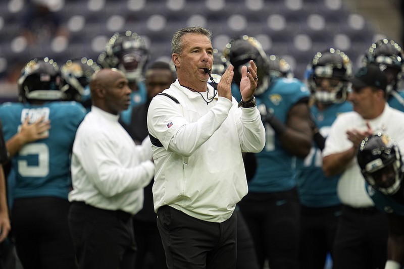 AP photo by Sam Craft / Jacksonville Jaguars coach Urban Meyer blows his whistle before the team's opener Sunday against the host Houston Texans.