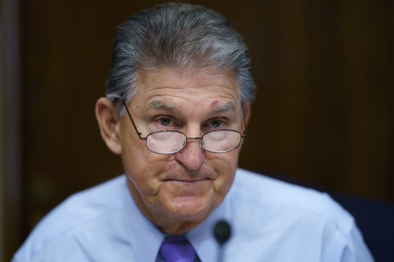 FILE - In this Aug. 5, 2021, file photo Sen. Joe Manchin, D-W.Va., prepares to chair a hearing in the Senate Energy and Natural Resources Committee, as lawmakers work to advance the $1 trillion bipartisan bill, at the Capitol in Washington. (AP Photo/J. Scott Applewhite, File)


