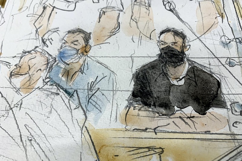 FILE - Sept.8, 2021 file sketch shows key defendant Salah Abdeslam, right, and Mohammed Abrini in the special courtroom built for the 2015 attacks trial. (Noelle Herrenschmidt via AP, File)


