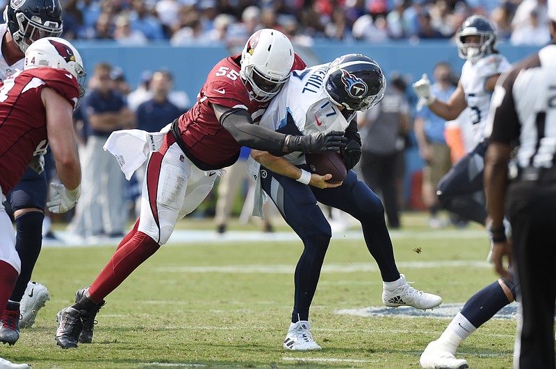 AP photo by Mark Zaleski / Arizona Cardinals linebacker Chandler Jones (55) sacks Tennessee Titans quarterback Ryan Tannehill during the second half of Sunday's season opener for both teams in Nashville. Jones tied a franchise record with five sacks, and the Cardinals totaled six sacks, twice forcing Tannehill to fumble.