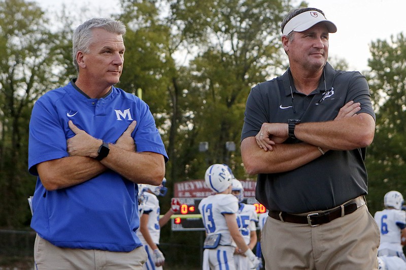 Staff photo / McCallie coach Ralph Potter, left, and Baylor counterpart Phillip Massey look on as their football teams warm up before the annual clash of Chattanooga private school powers in October 2019 at Baylor. Baylor and McCallie both compete in TSSAA Division II-AAA, where Potter's program is the two-time reigning state champion.