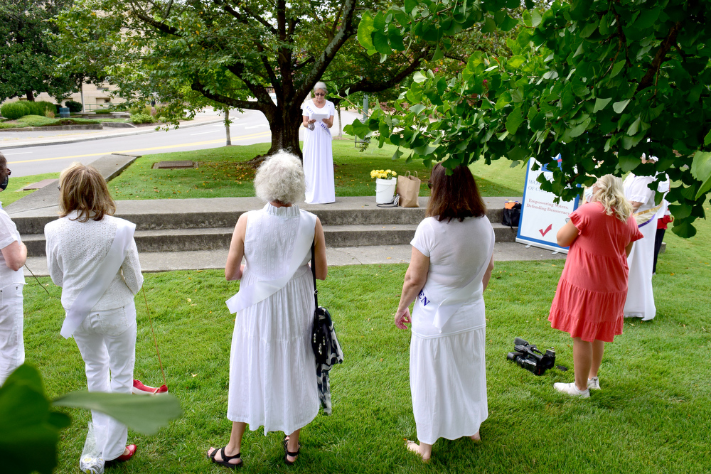 Staff Photo by Robin Rudd / League First Vice President Marcia Noe opens the program. The League of Women Voters of Chattanooga held a dedication ceremony on Friday, Sept. 17, 2021, to celebrate suffragist Abby Crawford Milton's work across the state for passage of the 19th amendment, ultimately winning women the right to vote. The ceremony was held in Philips Park at the corner of McCallie and Georgia Avenues where Milton's historical marker stands. The celebration included the installation of a plaque and park bench donated by the league.