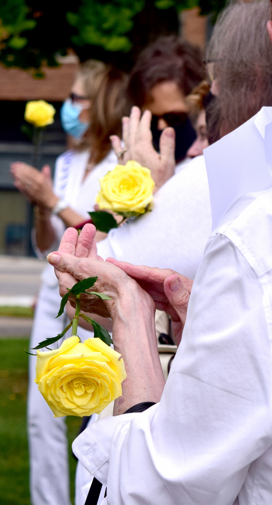 Staff Photo by Robin Rudd / The yellow rose is the symbol the suffrage movement. The League of Women Voters of Chattanooga held a dedication ceremony on Friday, Sept. 17, 2021, to celebrate suffragist Abby Crawford Milton's work across the state for passage of the 19th amendment, ultimately winning women the right to vote. The ceremony was held in Philips Park at the corner of McCallie and Georgia Avenues where Milton's historical marker stands. The celebration included the installation of a plaque and park bench donated by the league.