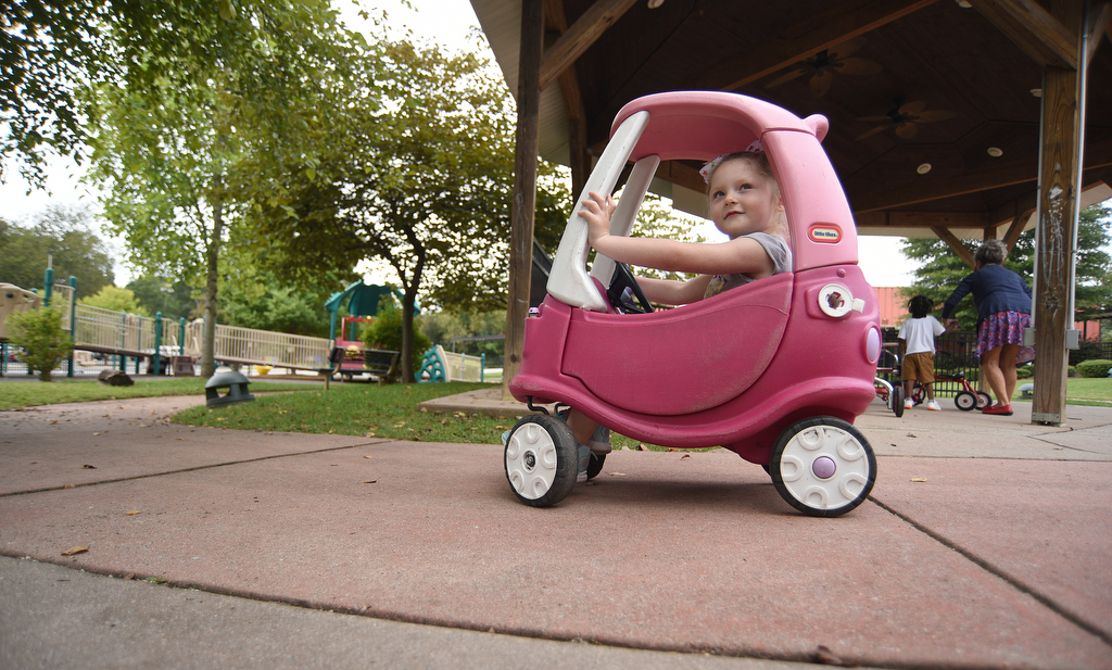 Staff Photo by Matt Hamilton / Scarlotte Lewis rides in a toy car on Thursday, September 16, 2021 at Signal Centers. Friends of Special Children is holding a fundraiser for playground equipment for Signal Centers.