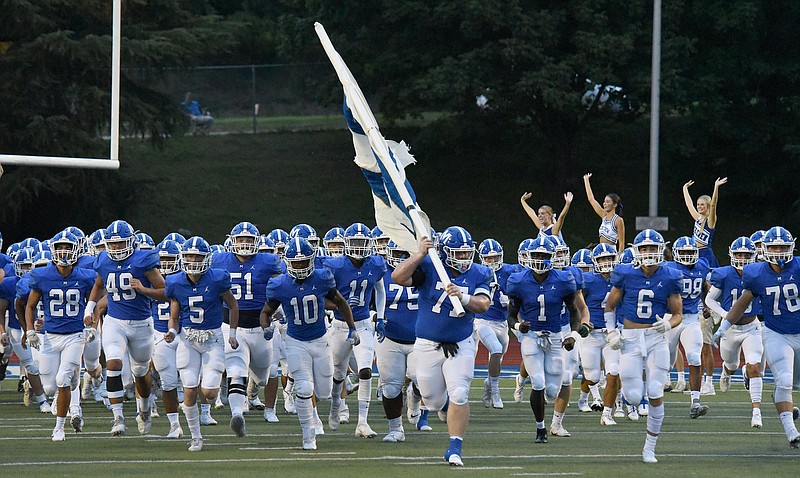 Staff Photo by Matt Hamilton / The McCallie players take the field on Friday. Knoxville Catholic played rival McCallie in Chattanooga on Friday, September 17, 2021. 