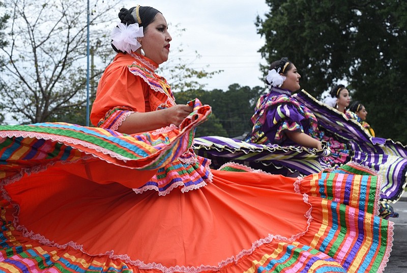 Staff Photo by Matt Hamilton / Monica Rivera, front, with dance group Xochipilli Folklorico, performs on Saturday, September 18, 2021 in Dalton during the Creative Arts Guild's 58th Annual Festival of Fine Arts and Crafts.