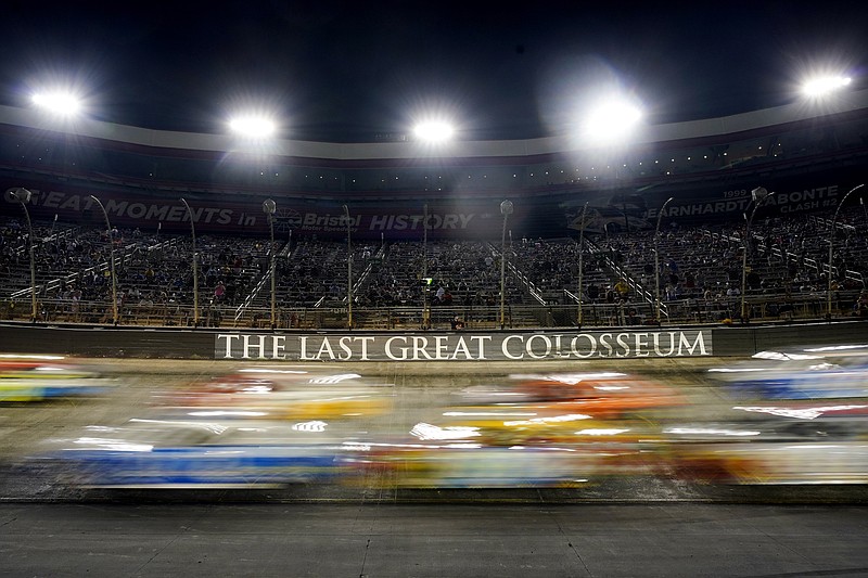 AP photo by Mark Humphrey / Cars come through a turn during Saturday night's NASCAR Cup Series race at Tennessee's Bristol Motor Speedway.