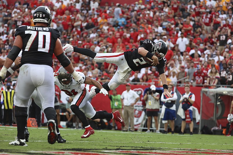 AP photo by Don Montague / Atlanta Falcons quarterback Matt Ryan (2) dives for a 2-point conversion during Sunday's game against the host Tampa Bay Buccaneers. Ryan was 35-of-46 passing for two touchdowns with three interceptions as the Falcons lost 48-25 to the Bucs in the NFC South opener for the division rivals.