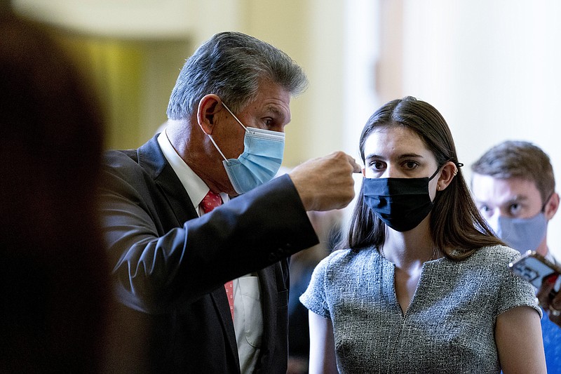 AP photo by Andrew Harnik / Sen. Joe Manchin, D-W.Va., speaks to an aide as he walks out of a Democratic policy luncheon at the Capitol in Washington on Sept. 14, 2021.