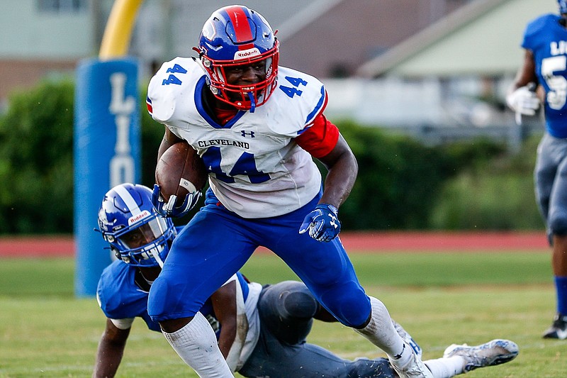 Staff photo by Troy Stolt / Blue Raiders tailback Tetoe Boyd (44) breaks a tackle during the football game between Red Bank and Cleveland high schools on Friday, Aug. 20, 2021 in Red Bank, Tenn.
