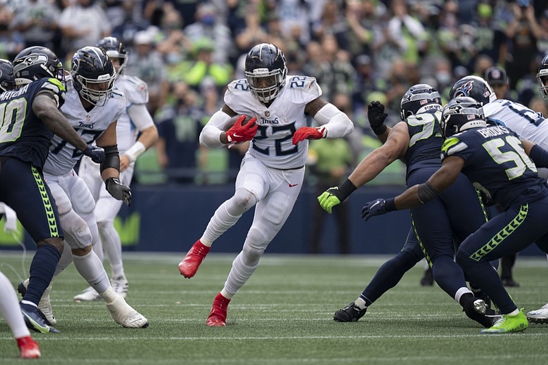 Tennessee Titans running back Derrick Henry runs with the ball during an NFL football game against the Seattle Seahawks, Sunday, Sept. 19, 2021, in Seattle. The Titans won 33-30 in overtime. (AP Photo/Ben VanHouten)


