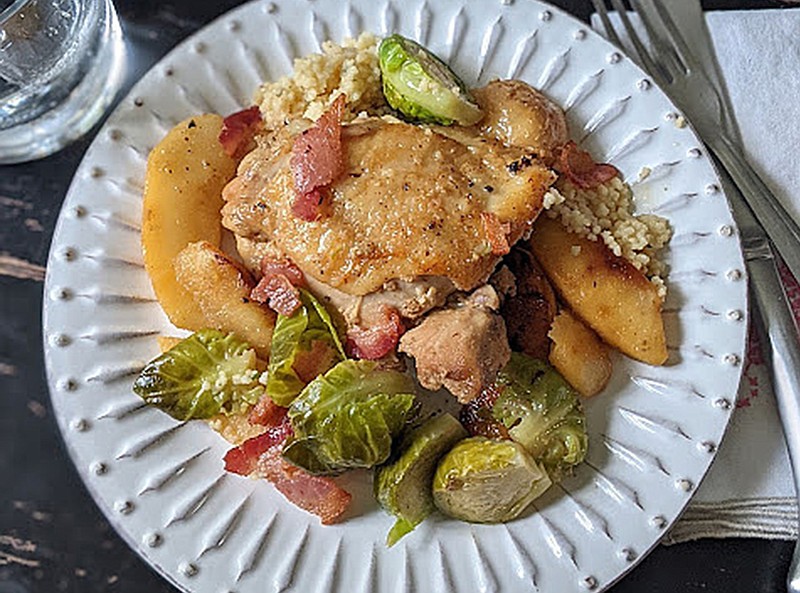 THUMBNAIL Chicken thighs braised in hard cider with Brussels sprouts and apples makes an easy one-pan fall dinner. / Photo by Gretchen McKay/Pittsburgh Post-Gazette/TNS