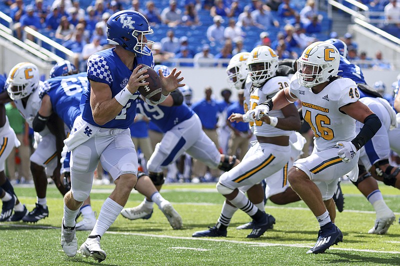 AP photo by Michael Clubb / UTC linebacker Ty Boeck (46) closes in on Kentucky quarterback Will Levis during Saturday's game in Lexington. Boeck, whose game-high 13 total tackles included a sack, was named the defensive player of the week by the SoCon for his performance in the Mocs' 28-23 loss.