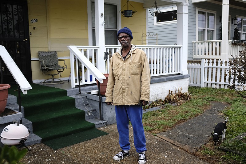 Staff file / James Woods, a resident of the Jefferson Heights neighborhood for more than 60 years, poses for a portrait in front of his home with his dog Falco on Friday, Jan. 12, 2018, in Chattanooga, Tenn. Jefferson Heights is among eight neighborhoods in Chattanooga's Southside identified as having lead-contaminated soil.