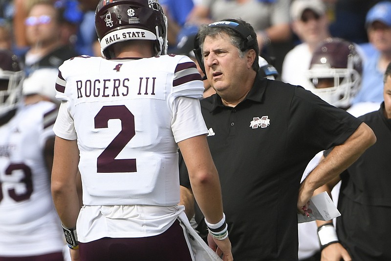 AP photo by John Amis / Mississippi State football coach Mike Leach talks to quarterback Will Rogers during the first half of the Bulldogs' game Saturday at Memphis. The Tigers won 31-29 after going ahead for good with less than six minutes remaining in the fourth quarter after returning a punt 94 yards for a touchdown, a controversial play that put SEC officials in an unwanted spotlight.