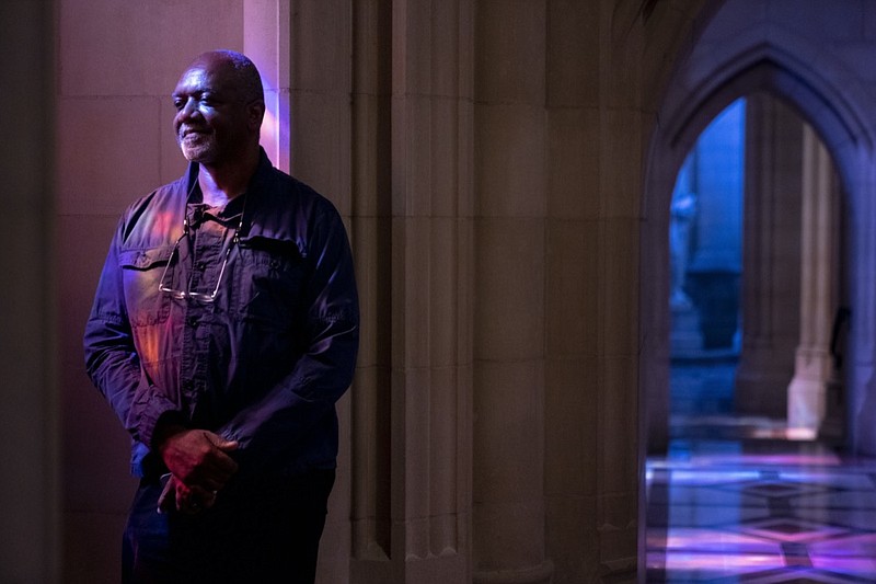 Artist Kerry James Marshall poses for a portrait in the National Cathedral after being selected to design a replacement of former confederate-themed stained glass windows that were taken down in 2017, in Washington, Thursday, Sept. 23, 2021. (AP Photo/Andrew Harnik)
