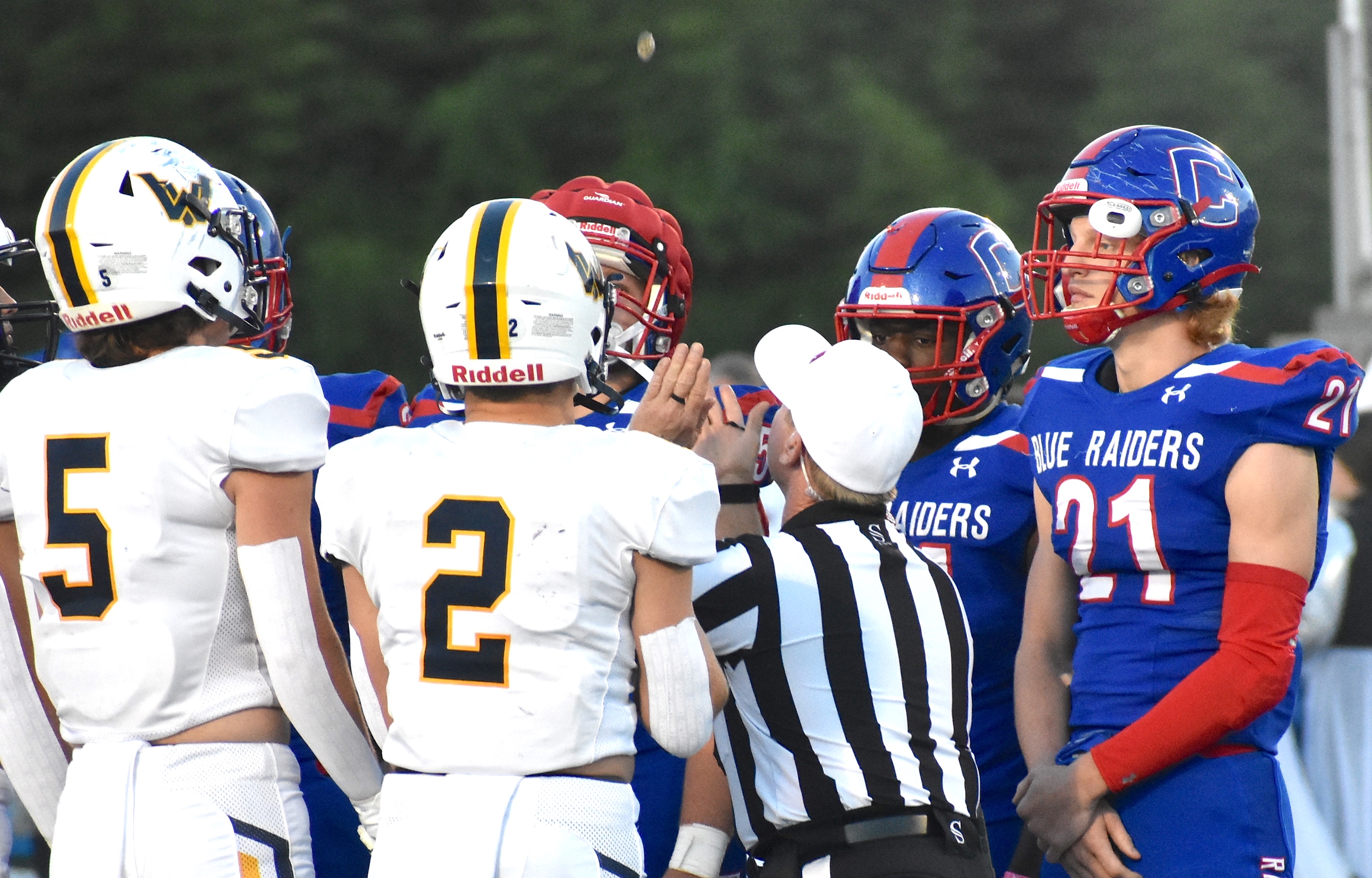 Staff photo by Patrick MacCoon / Cleveland and Walker Valley players meet at midfield before Friday night's kickoff at Benny Monroe Stadium.