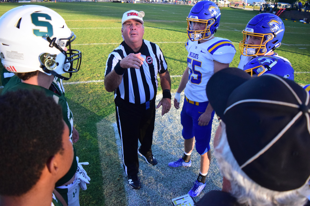 Staff Photo by Robin Rudd / The referee tosses the coin in front of the captains at midfield. The Silverdale Academy Seahawks hosted the Donelson Christian Academy Bobcats in TSSAA football on September 24, 2021.