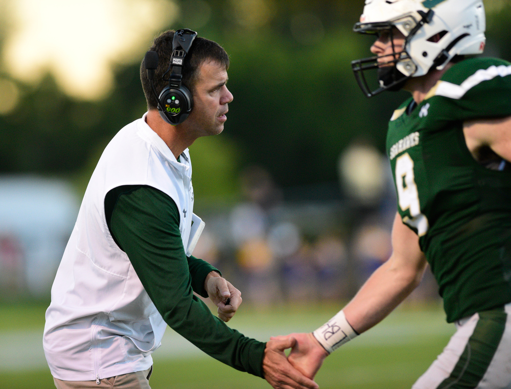 Staff Photo by Robin Rudd / Silverdale head coach Mike Connor congratulates Chase Manning (9) after a extra point. The Silverdale Academy Seahawks hosted the Donelson Christian Academy Bobcats in TSSAA football on September 24, 2021.